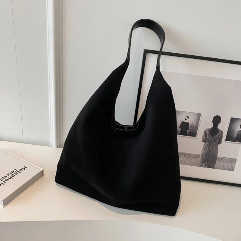 Womens slouchy tote handbag with wide shoulder strap in black