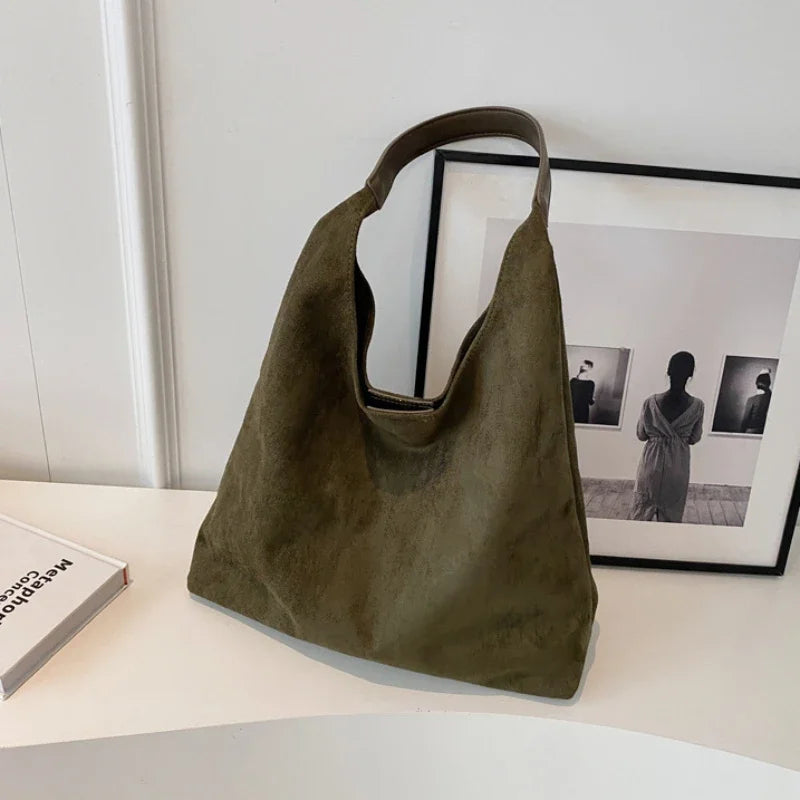 Womens slouchy tote handbag with wide shoulder strap in green